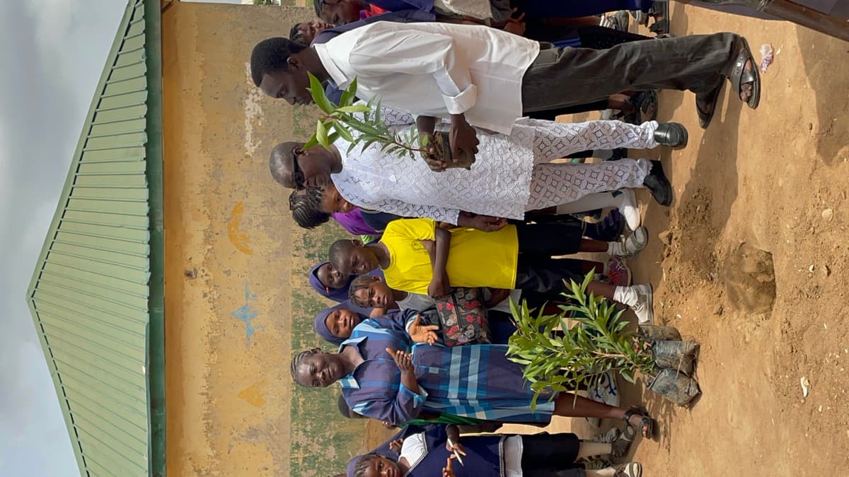 Community members with tree saplings